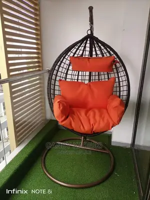Beautiful Garden Swing With Orange Cushions