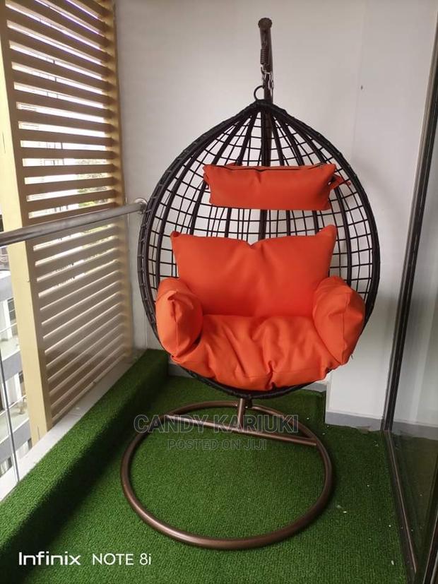 Beautiful Garden Swing With Orange Cushions