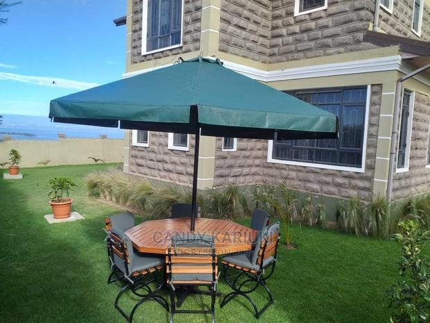 6 Seater Outdoor Set With Padded Seat and an Umbrella