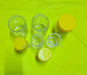 Different Sizes of Honey Plastic Packaging Tins - main view
