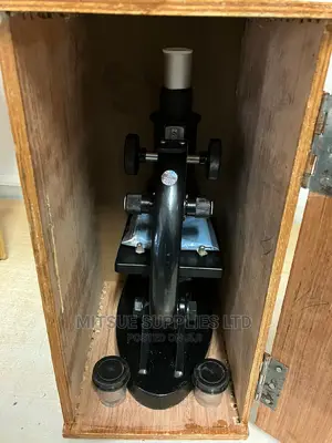 Budget Monocular Microscope Screwed In A Wooden Case