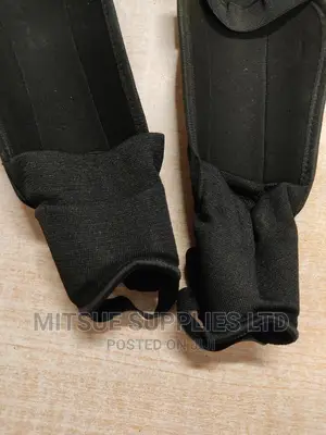 A Pair of Football/Hockey Shin Guard With Anklet