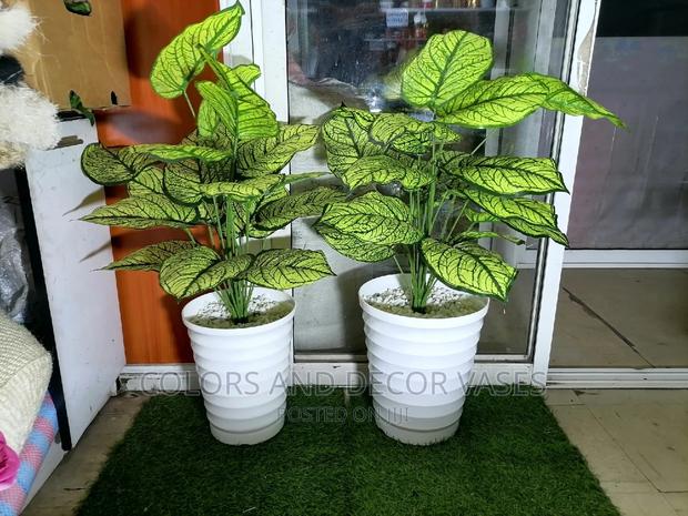 Plants Artificial With Pebble Stones in a Plastic Vase - main view