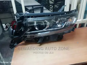 Prado 165 Headlight Xenon Black Shed.