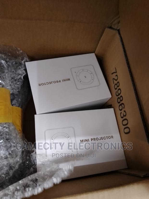 Handheld Mini Projector With Smart Tv Apps - thumbnail 3