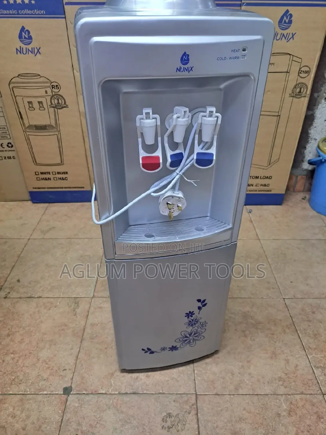 Water Dispenser Grey in Color Hot, Cold and Grey.