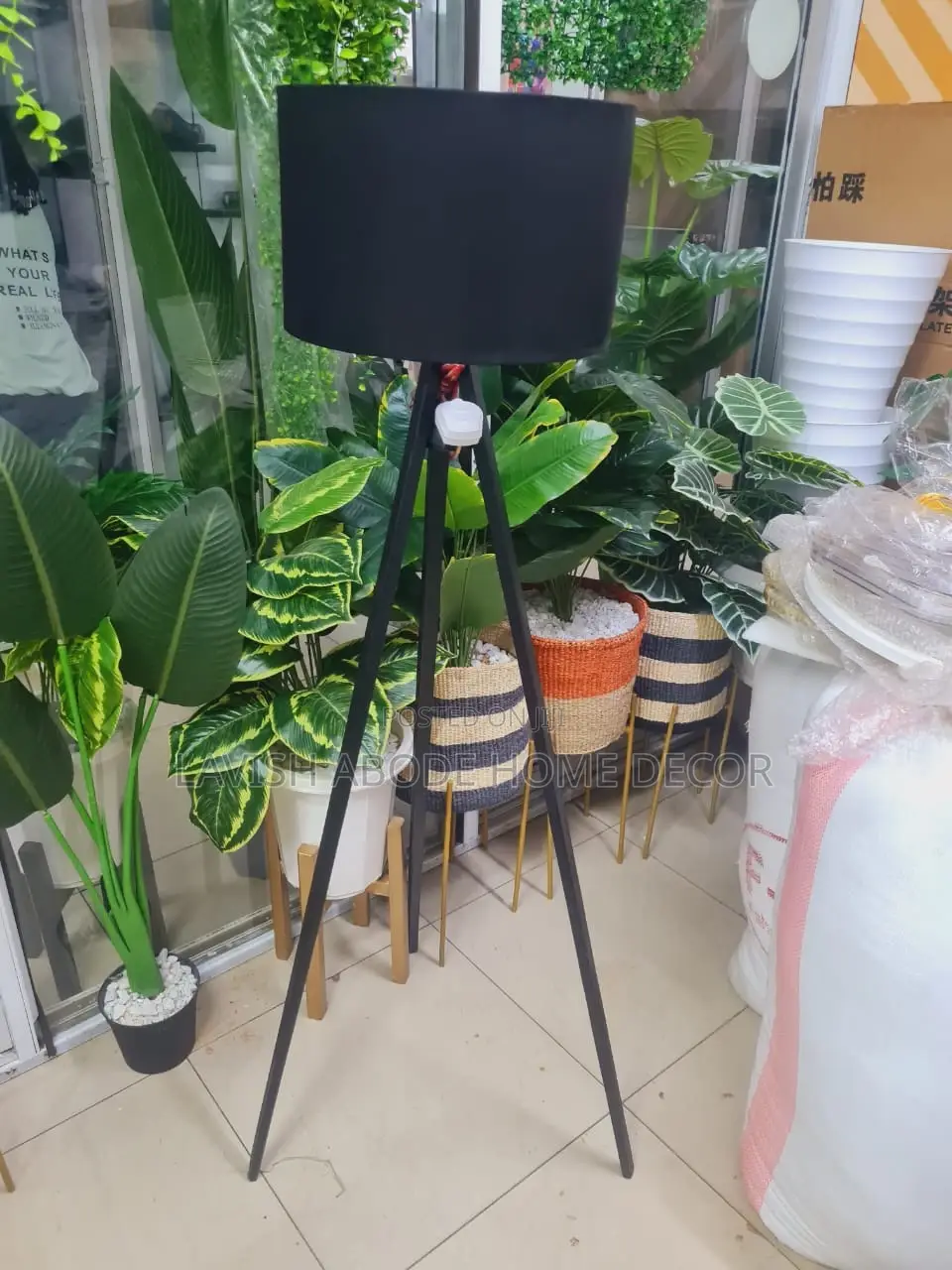 Tripod Floor Standing Lamp With a Black Lampshade Decor