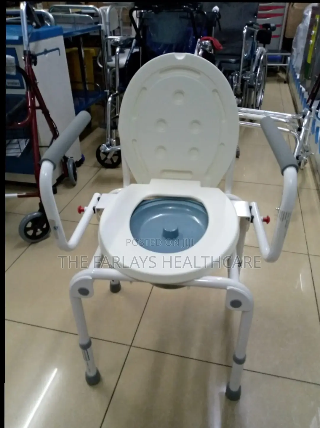Commode Seat With Flip Armrests.