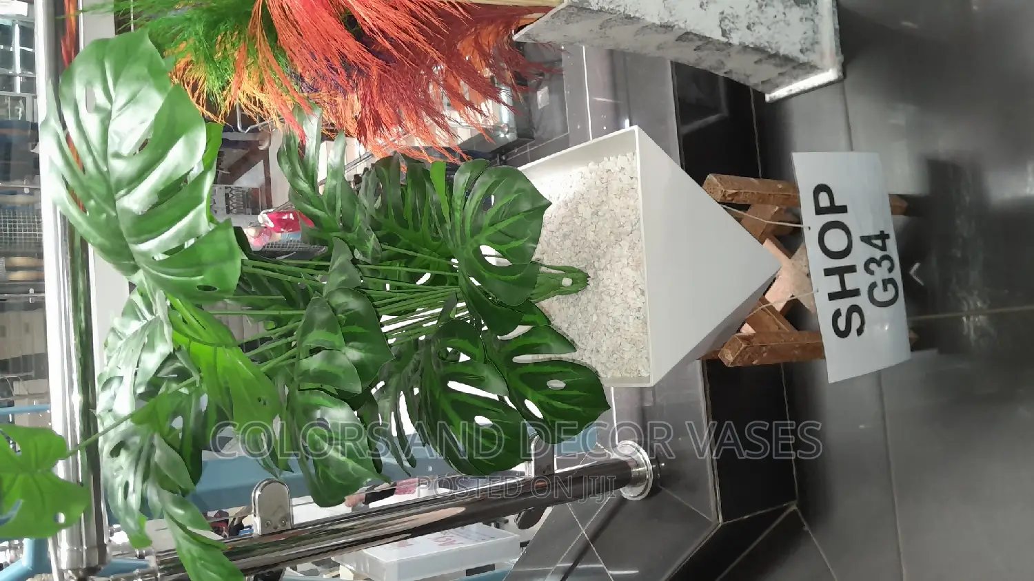 Plastic Vase With Artificial Plant and Stand