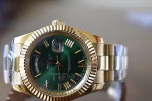 Rolex Day and Date Green Dial Yellow Gold Roman Numbers
