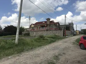 Large 50 By100 Plot Syokimau in a Court