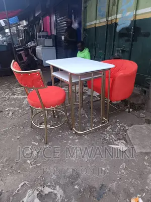 Manicure Set, Orange Seats and Marble Table.