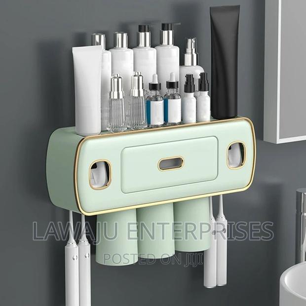 Toothbrush and Toothpaste Holder With Automatic Dispenser