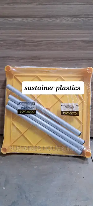 Yellow Plastic Table With Metal Tubing Legs