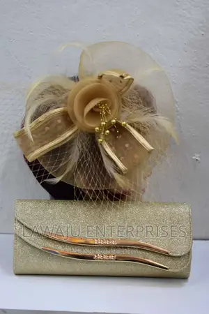 Dotted Gold Feather Fascinator
