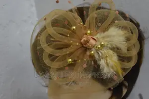Dotted Gold Feather Fascinator
