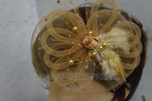 Dotted Gold Feather Fascinator