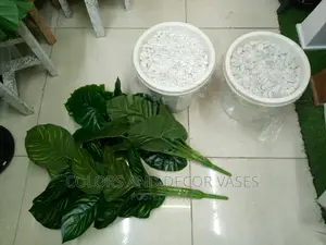 Artificial Plants With Plastic Vase and Pebble Stones