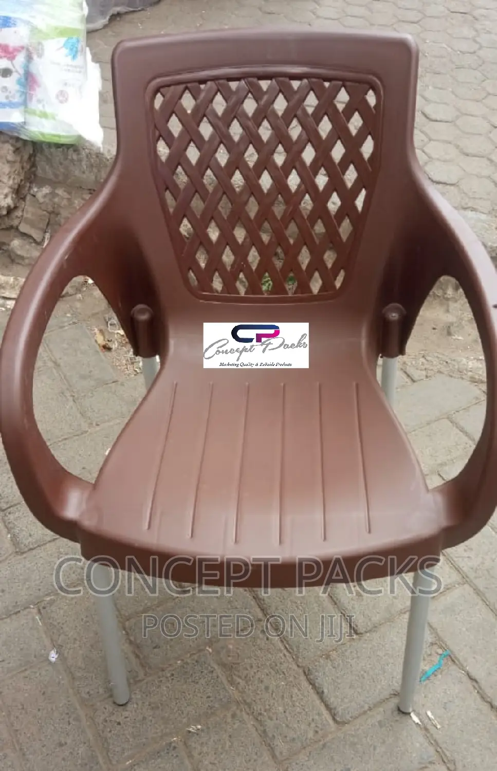 Brown Plastic Chair With Metal Tubing Legs.