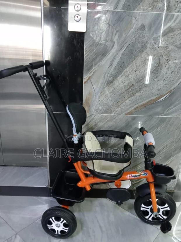 Orange Tricycle With Protective Side Bar Push Handle - main view
