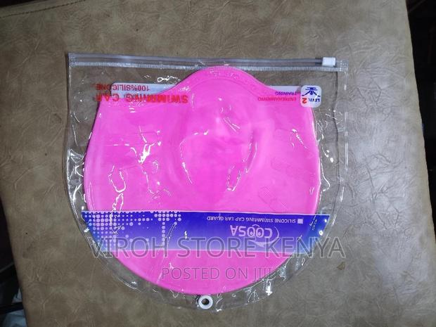 Pink Silicone Swimming Cap With Ear Guards - Stretching - main view