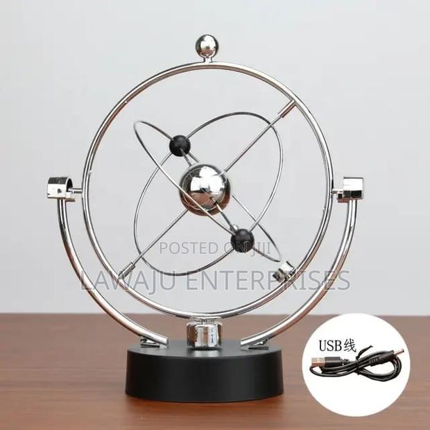 Rotating Newton Pendulum Ball Balance