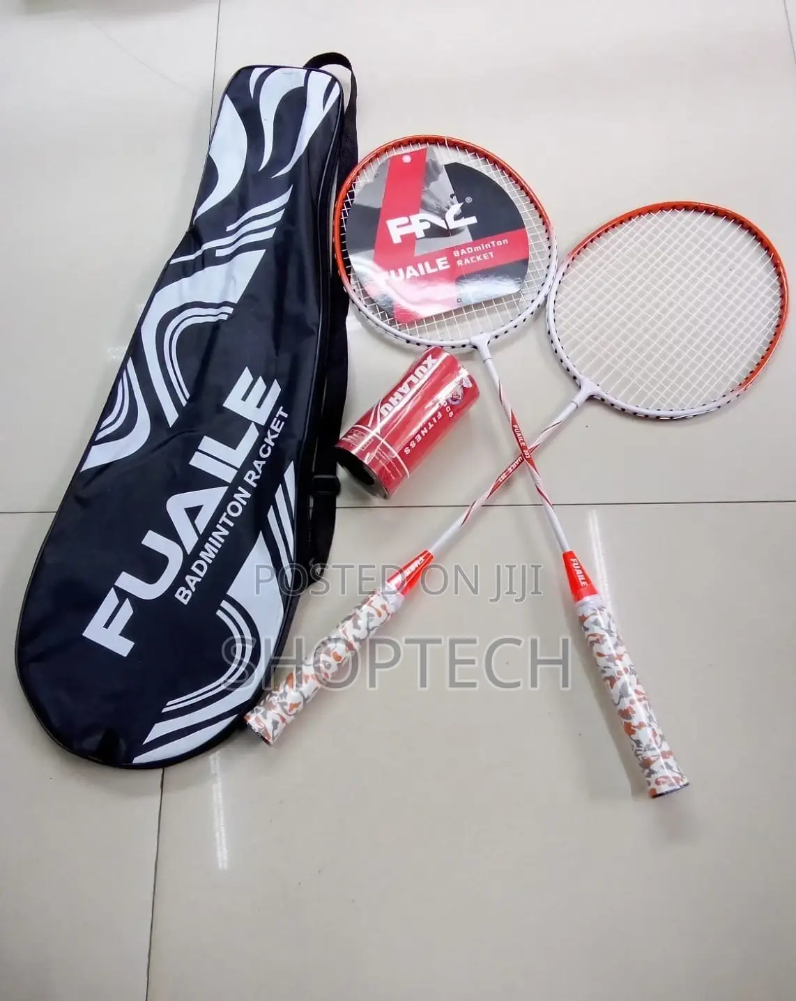 A Pair of Badminton Rackets With 2 Shuttlecocks