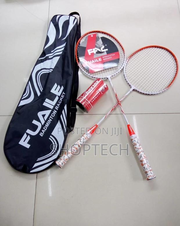 A Pair of Badminton Rackets With 2 Shuttlecocks