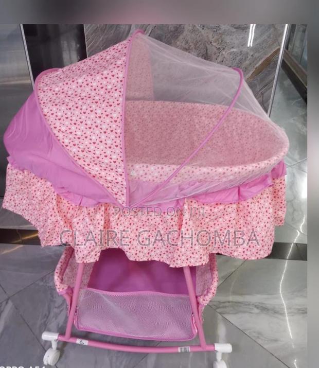 Foldable Pink Baby Bassinet With Rocking Wheels - main view