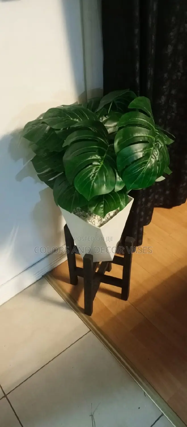 Plant Artificial in Plastic Vase With Pebble Stones Stand