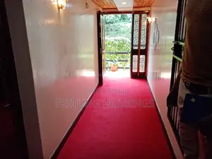 Wainscoting and Wall to Wall Red Carpet