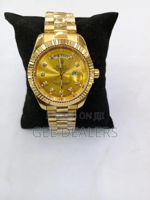 Rolex Wrist Watch .Gold Colour