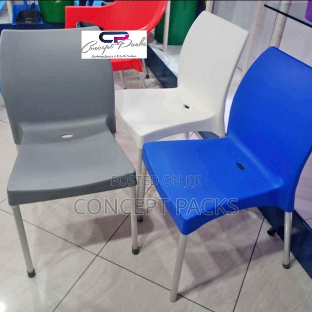 Armless Plastic Chair With Metal Tubing Legs.