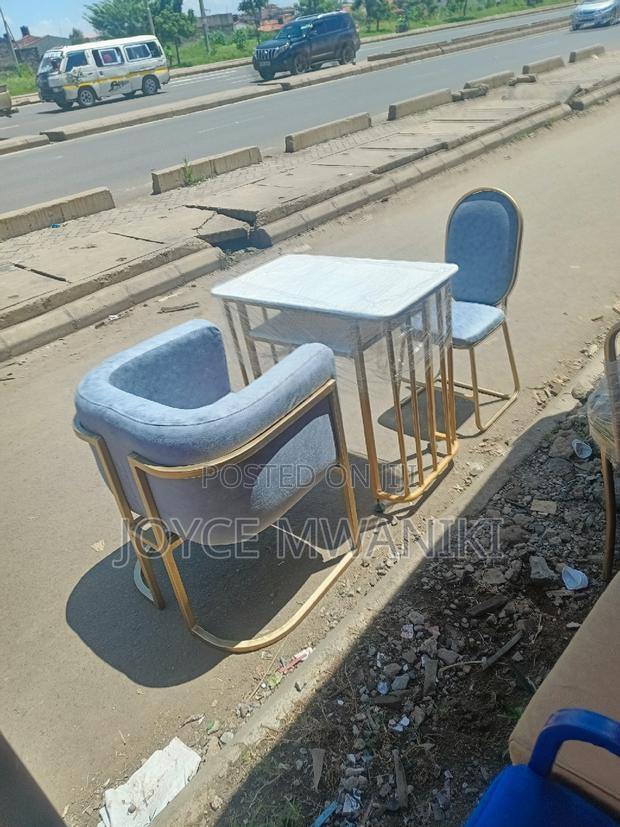 Manicure Set, Grey Seats and a Marble Table - main view