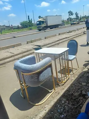 Manicure Set, Grey Seats and a Marble Table 