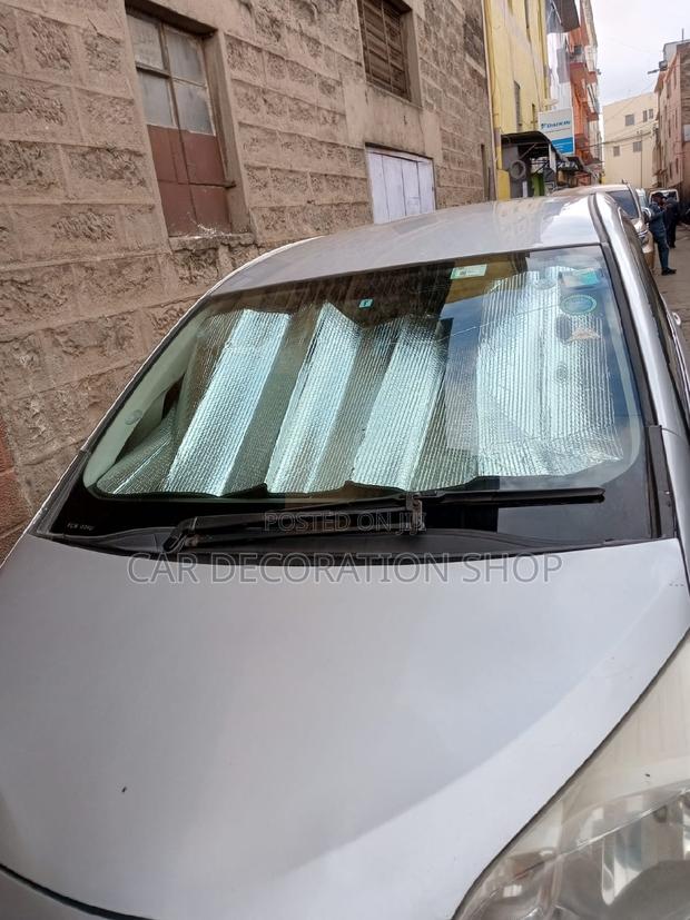 Ractis Dashboard Covered With Reflective Sunshade Cover