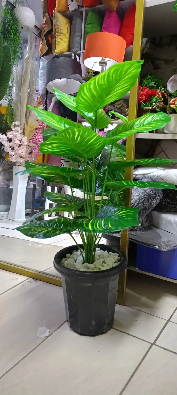 Artificial Green Plant In A Black Pot