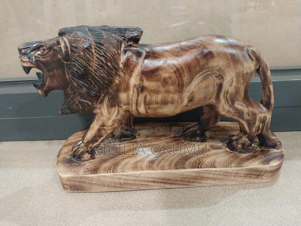 Lion on a Stand Wood Carving