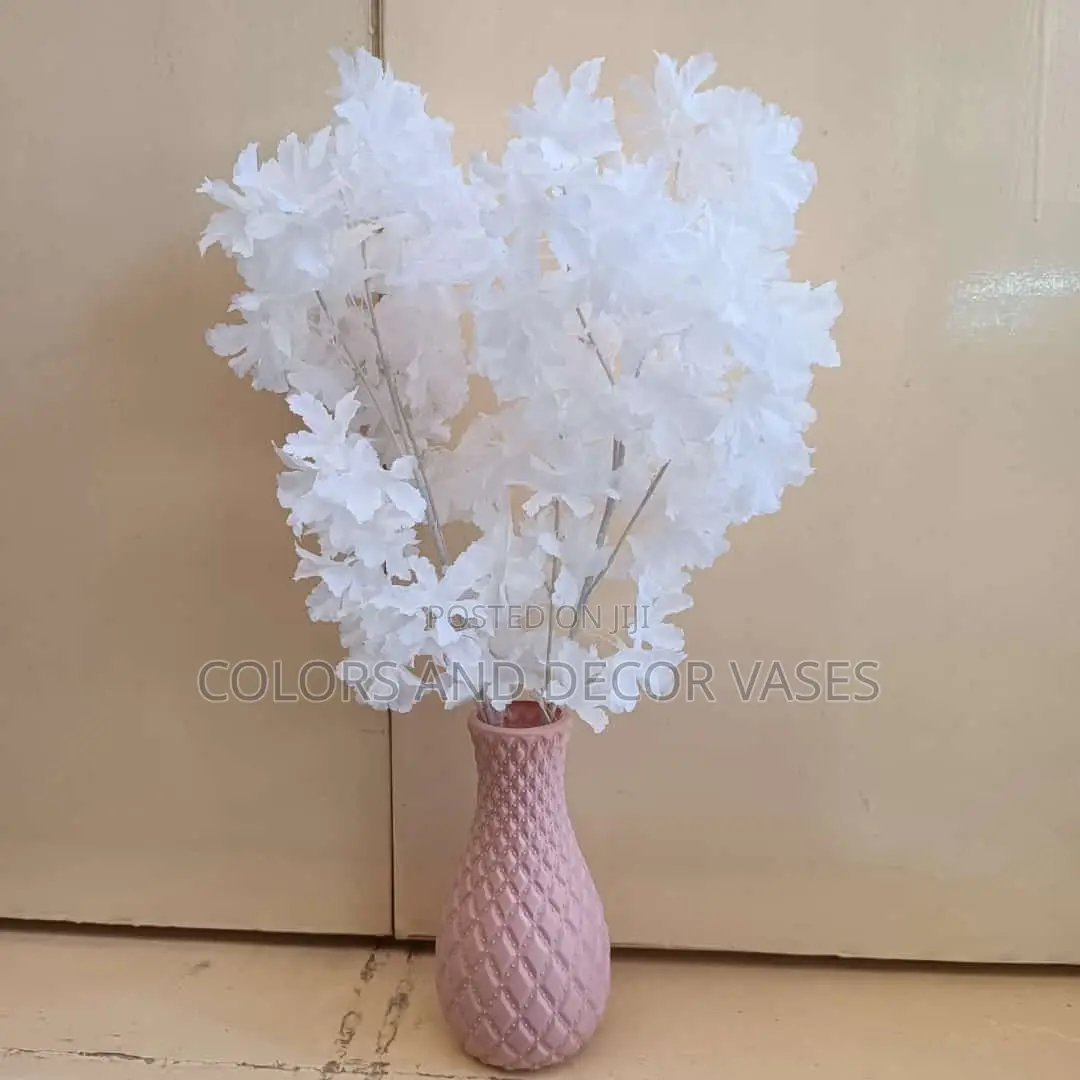Blossom Flowers With Plastic Vase