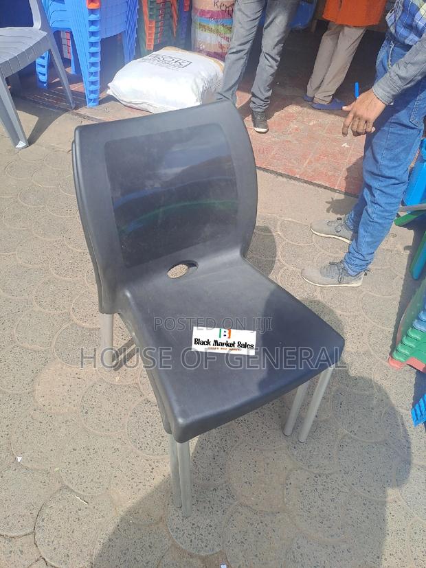 Black Armless Plastic Chair With Metal Legs