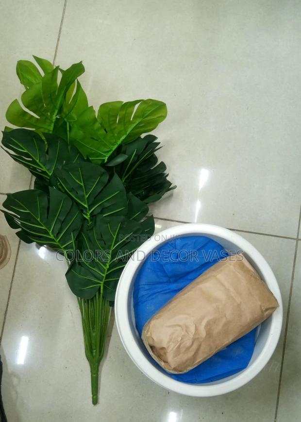 Plastic Vase, Stones and Artificial Plant