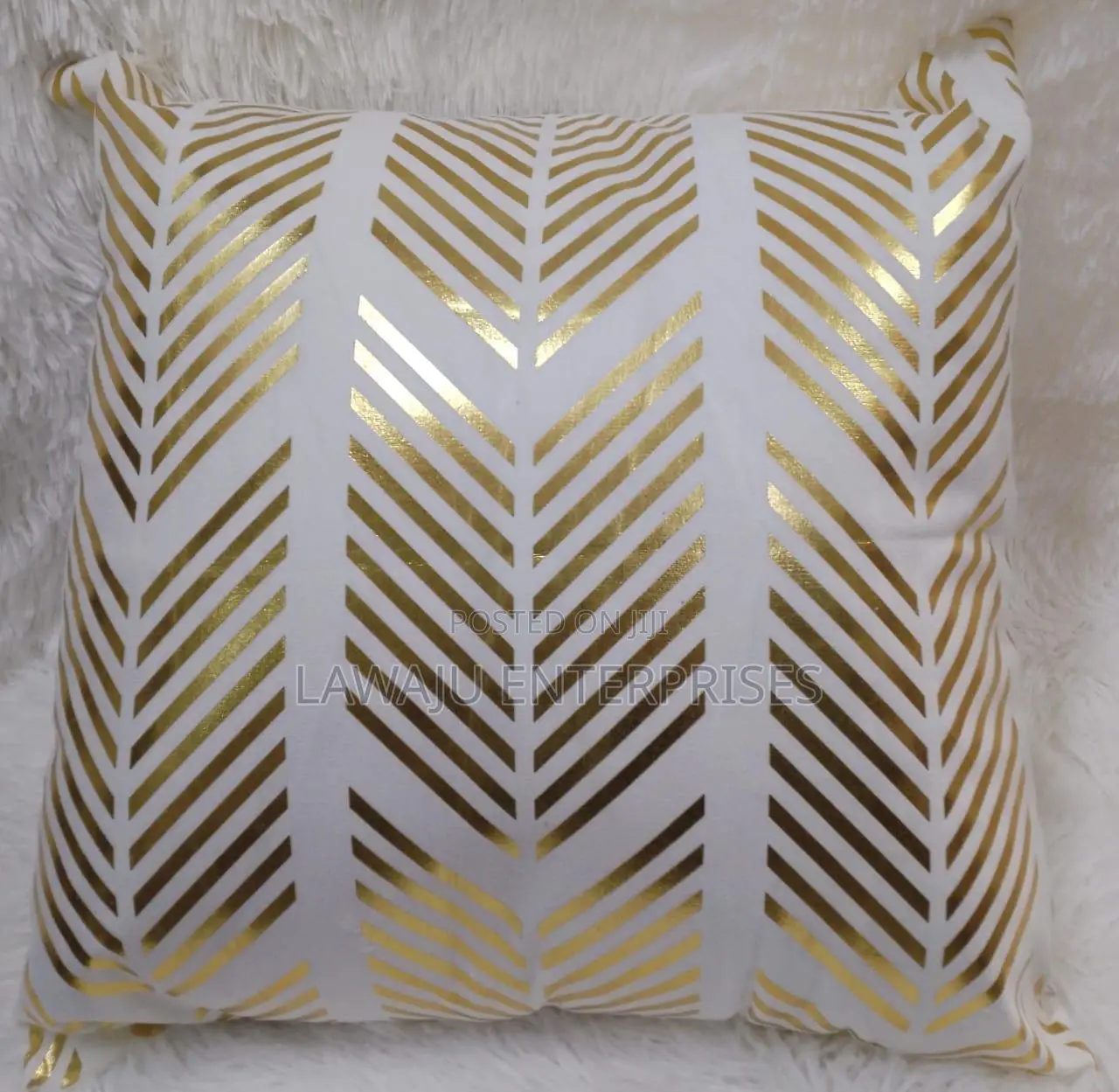 White Case With Gold Detail and Pillow