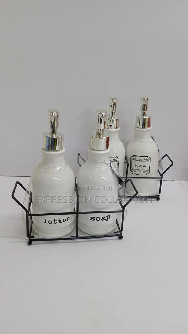 Soap and Lotion Dispenser With Metallic Stand.