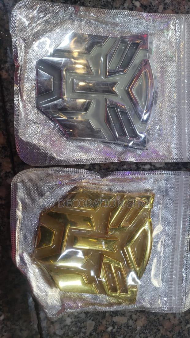 Gold or Silver Metallic Transformer Badge - main view
