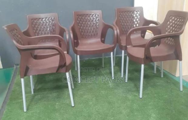Strong Brown Plastic Chair With Chrome Legs. - main view