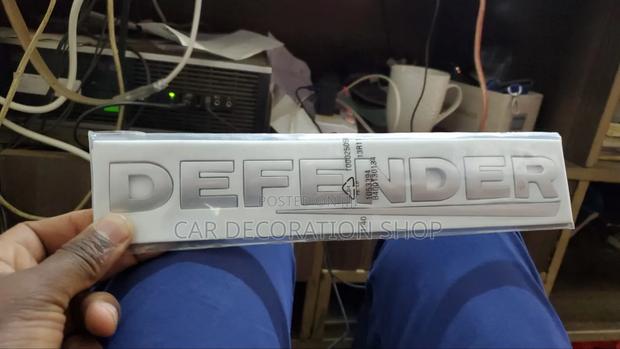 Silver DEFENDER Boot Badge