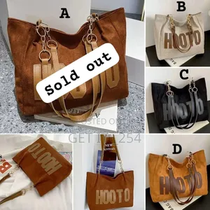 . *Letter Patch Detail Shoulder Tote Bagsize: 32×27×14cm
