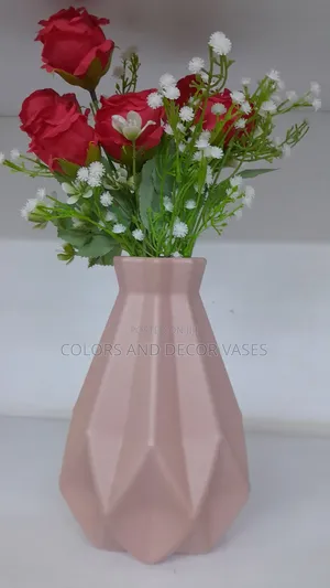 Pink Plastic Vase With Red and White Flowers