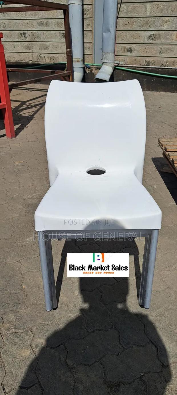 White Plastic Chair With Metal Tubing Legs