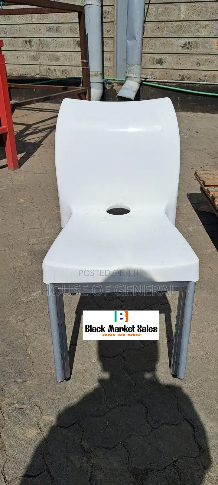 White Plastic Chair With Metal Tubing Legs